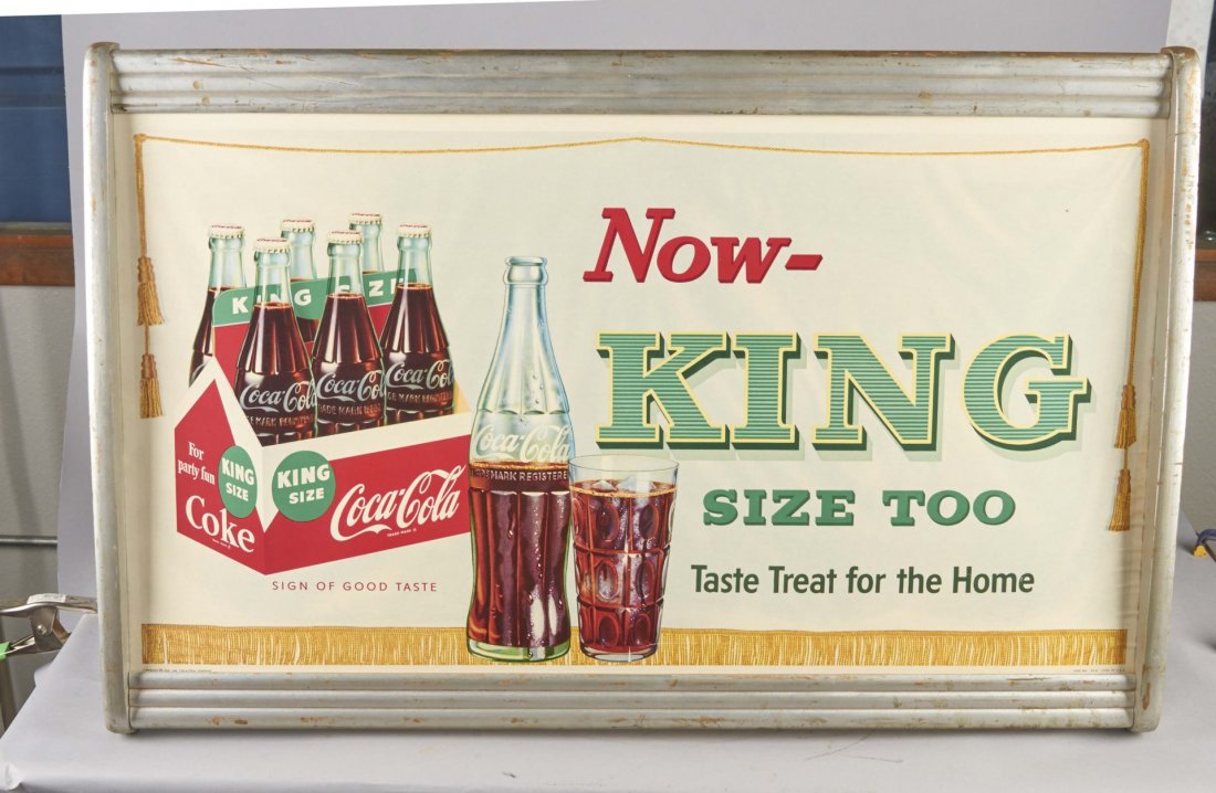 Coca Cola Advertisement In Silver Frame: Print lithograph featuring the King size bottle of coke. Poster reads, "Now-King Size Too! Taste Treat for the Home!" Condition (Very good). Size 20" x 36"