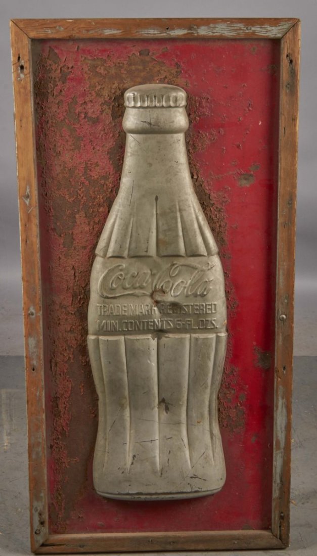 50th Anniversary Coke Sign With Bottle: Framed tin embossed Coca Cola bottle, which is slightly pressed in around the middle of the bottle. Metal background was painted red and has severe flaking in in large areas. Condition (Fair). Size 24