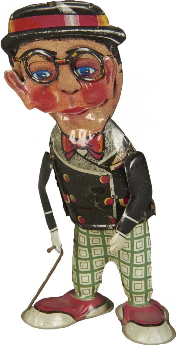 Tin Litho Harold Lloyd Wind-Up Walker Toy: Funny face toy by Marx. Condition (Excellent). Size 11" T.