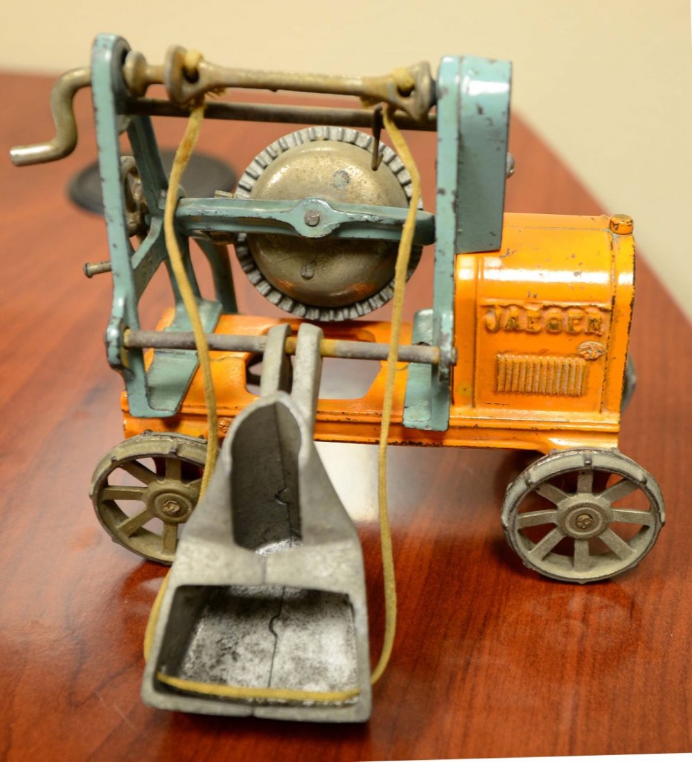 Pressed Steel Buddy L Concrete Mixer: Restored in yellow with black turning crank and red/green mixer. Condition (Restored). Size 8-1/2" L.