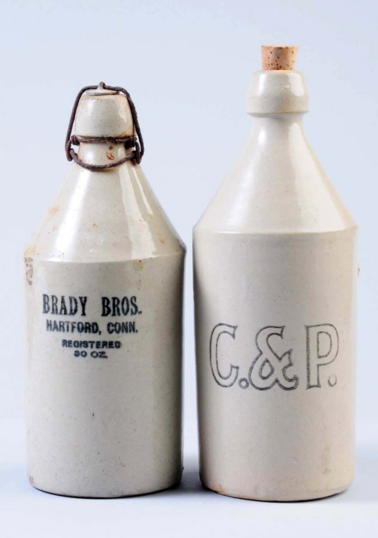 Lot of 2: Stoneware Bottles.: The first bottle is marked " Brady Brother's Hartford, Con. Registered 30 ounces. This bottle has some minor staining and some glaze pops. " The second bottle is marked "C. & P.". Condition (Very Good