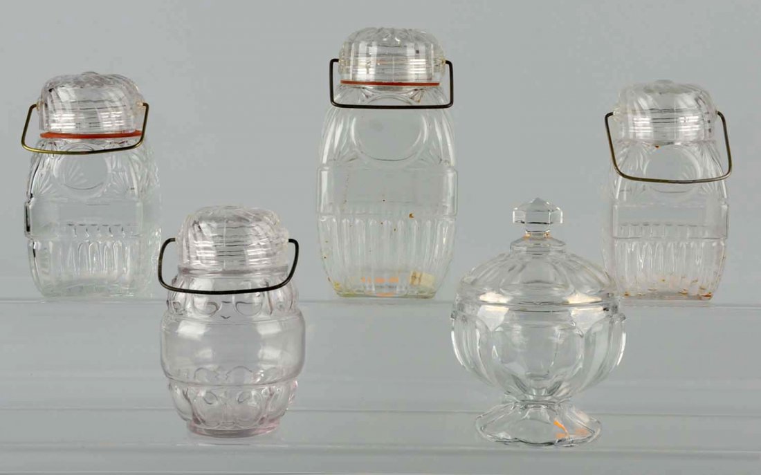 Lot of 5: Glass Candy Jars.: Four with bail lids and one with a screw lid. No damage. Condition (Excellent). Size Largest : 8" T.