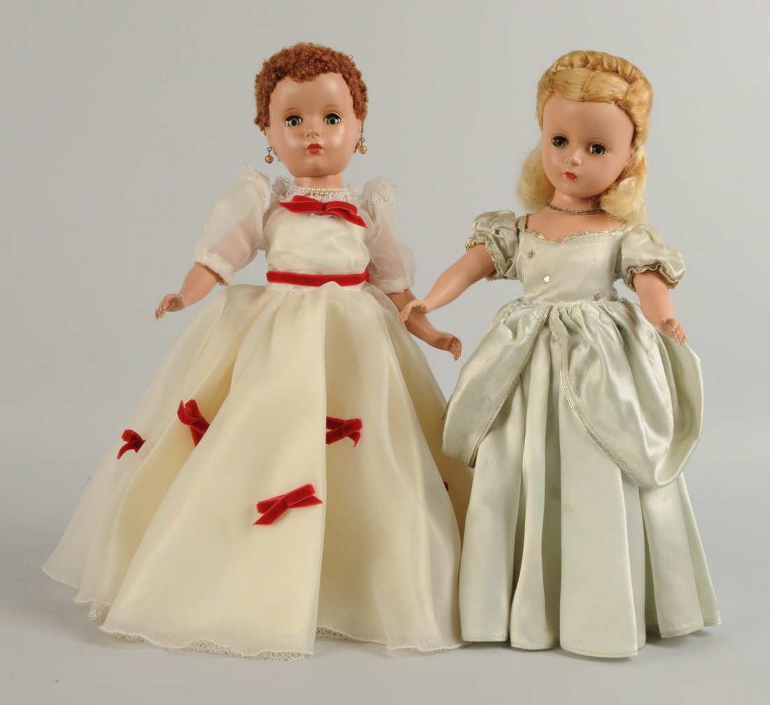 Lot Of 2: 1950's Hard Plastic Madame Alexander's.: Madame Alexander dolls. Cinderella in tagged original outfit with replaced shoes. Mary Martin redressed, original wig. Both dolls in played with condition. Cinderella has slight odor. Condition (Fair)