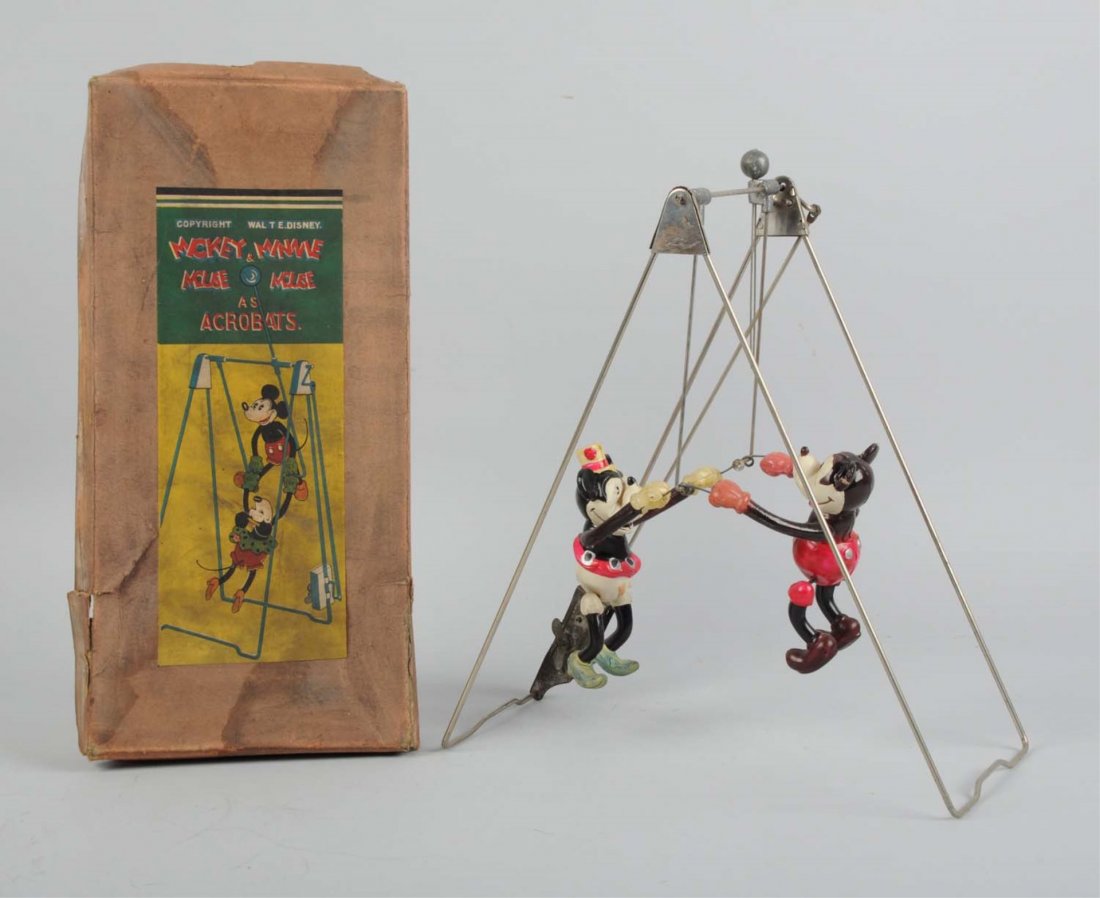 Japanese Mickey & Minnie Mouse Acrobats.: The toy includes celluloid figures of Mickey and Minnie mouse. Minnie has a hole in her hat, and her nose is a little smooched. The Mickey appears to be fine, no scratches or dents. The toy also comes