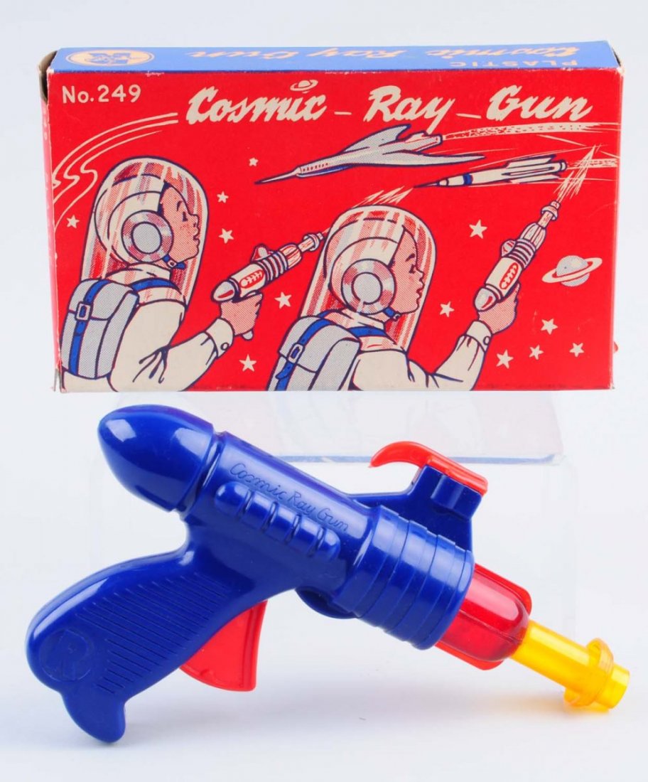 Plastic Friction Cosmic Ray Gun.: No. 249. Includes original box. Scratching throughout. The box has minor sections of paper pulls and creasing. Condition (Very Good - Excellent). Size 8" L.