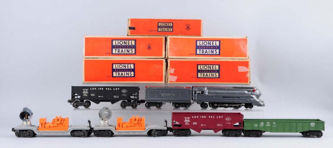 Lionel 1668 With Assorted Post-War Cars.: 1668 steam engine locomotive has been repainted but is still complete. Comes with tender that has also been repainted with a whistle with post war trucks attached to it. 6462-25 Londla in green comple