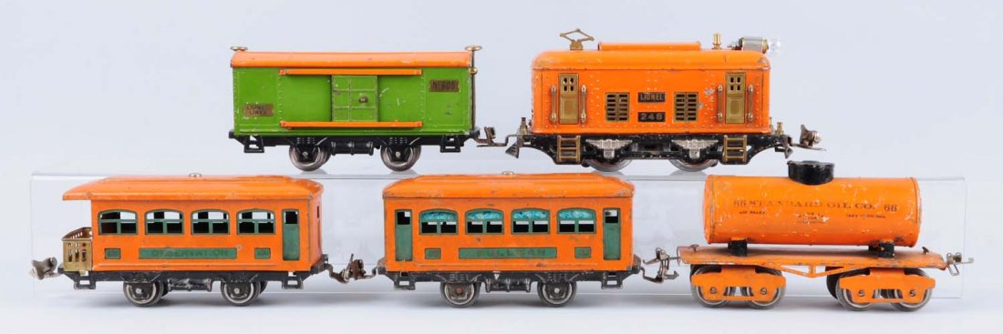 Lionel Orange 248 Locomotives.: Lionel 248 loco is orange and has been re wheeled otherwise complete and original in good conditon. Few scratches and paint chips. 525 pullman is in good condition with some scratches. Ives 66 orange