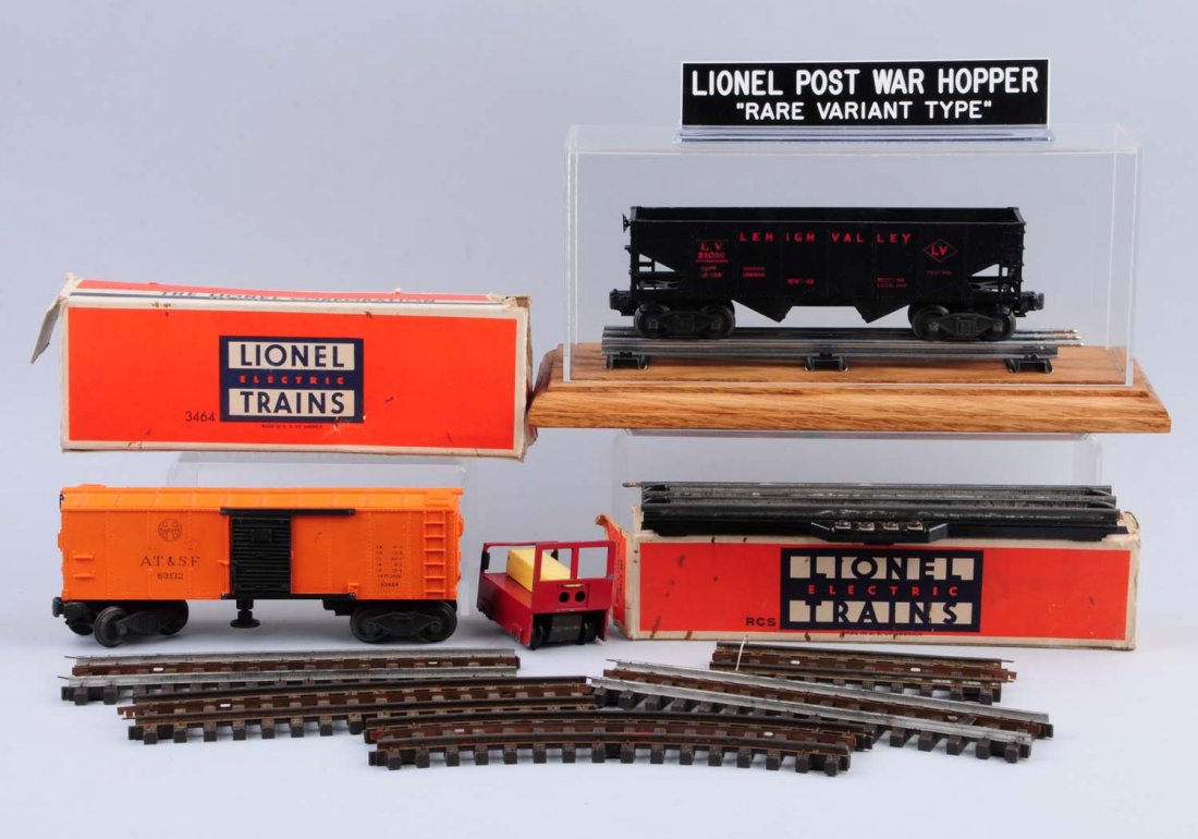 Lionel 6456 Lehigh Valley Hopper, 3465 Box Car +.: Lionel 6456 Lehigh Valley hopper with maroon lettering, i have to think this hopper is a fake, has staple and trucks, comes with a display case. 3464 Santa Fe operating box car, very clean and attract
