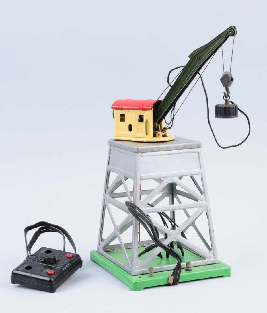 Lionel 165 Crane.: Earliest version, control is missing one button, otherwise it is complete. Green boom, some scratches and paint chips.