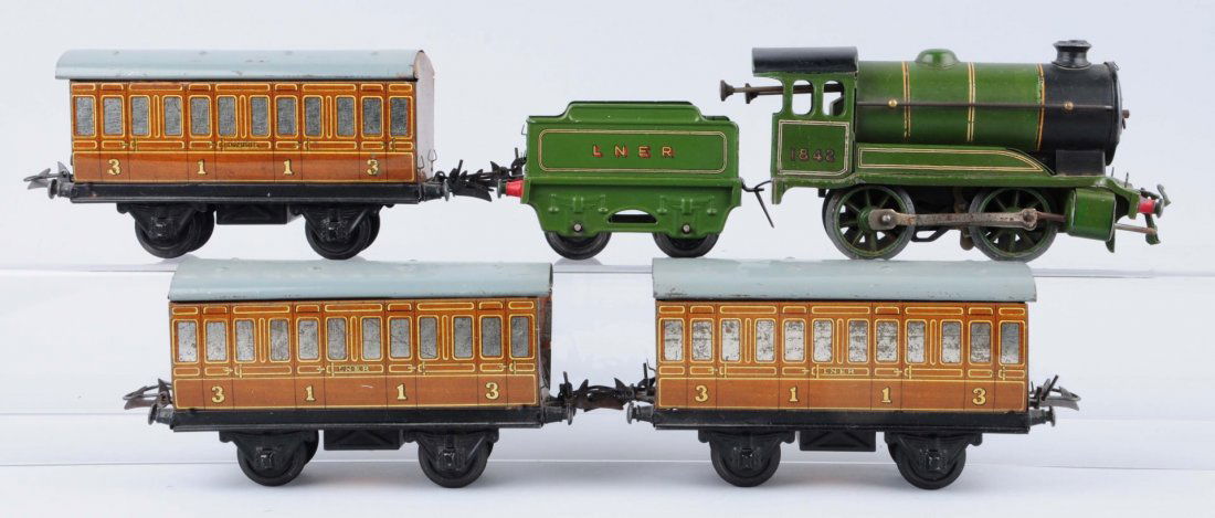 Hornby Five Piece Wind-up Set.: Horby 0-4-0 steam locomotive is complete and original in excellent condition. Passenger car is complete and original with a few scratches on the roof. Good condition. Second passenger car has some scr