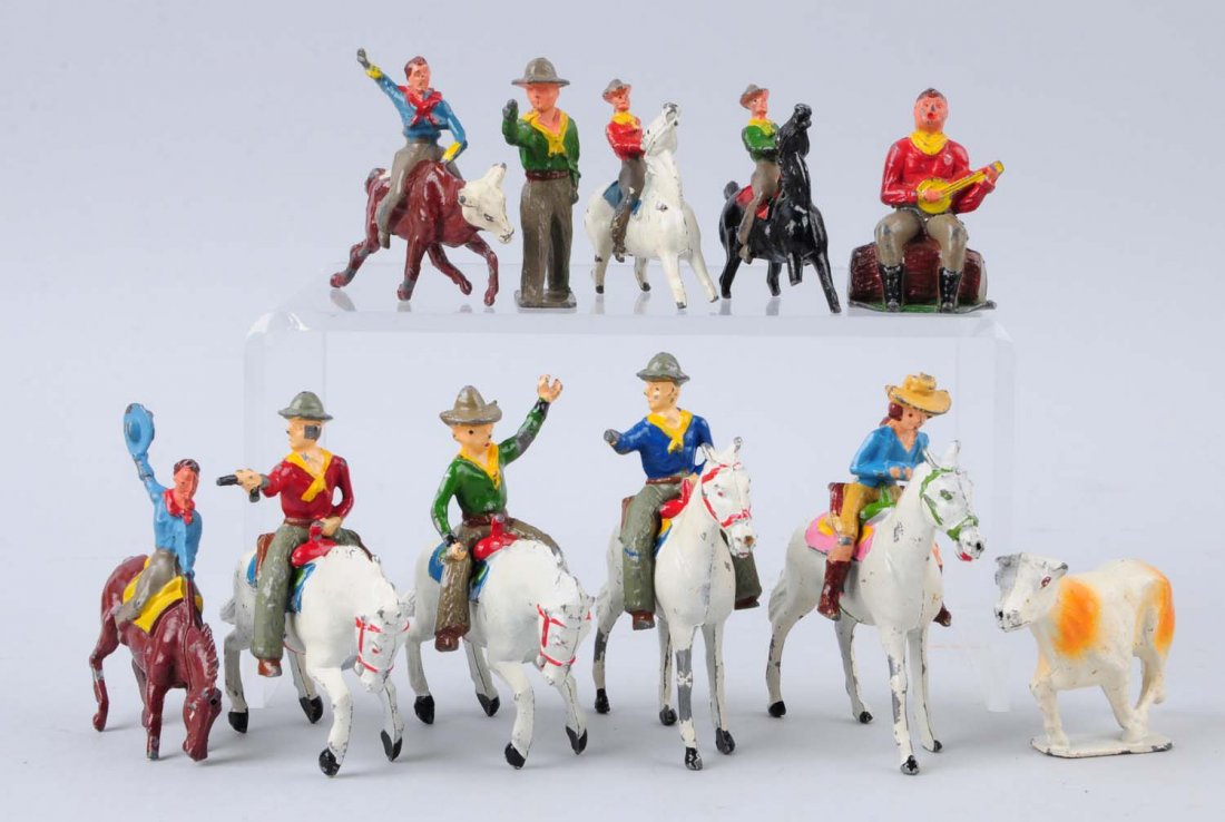 Assorted Charbens Mounted Cowboys.: Lot consists of one cowboy running, one cowboy mounted bucking brunko. Broken tail. One cowboy mounted on bull with broken arm. One cowboy playing banjo sitting on bench in good condition. Four circus