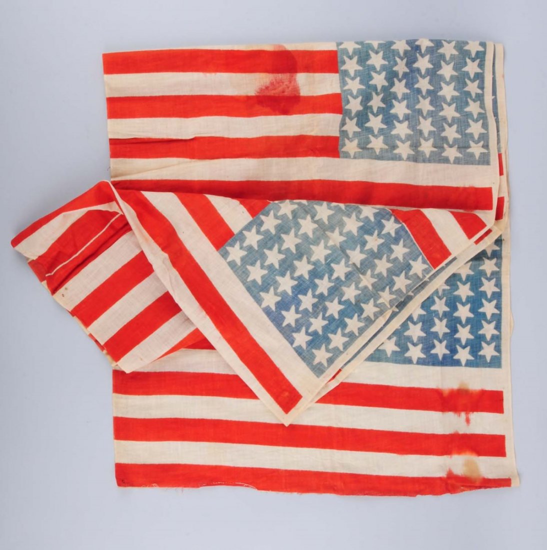 Uncut Fabric Of 6 42-Star American Flag.: This piece of fabric is an uncut section of six 42 - star flags. A few areas of bleeding or staining. The 42 - star flag was never an official flag. Condition (Very Good). Size 106" L x 24" H.