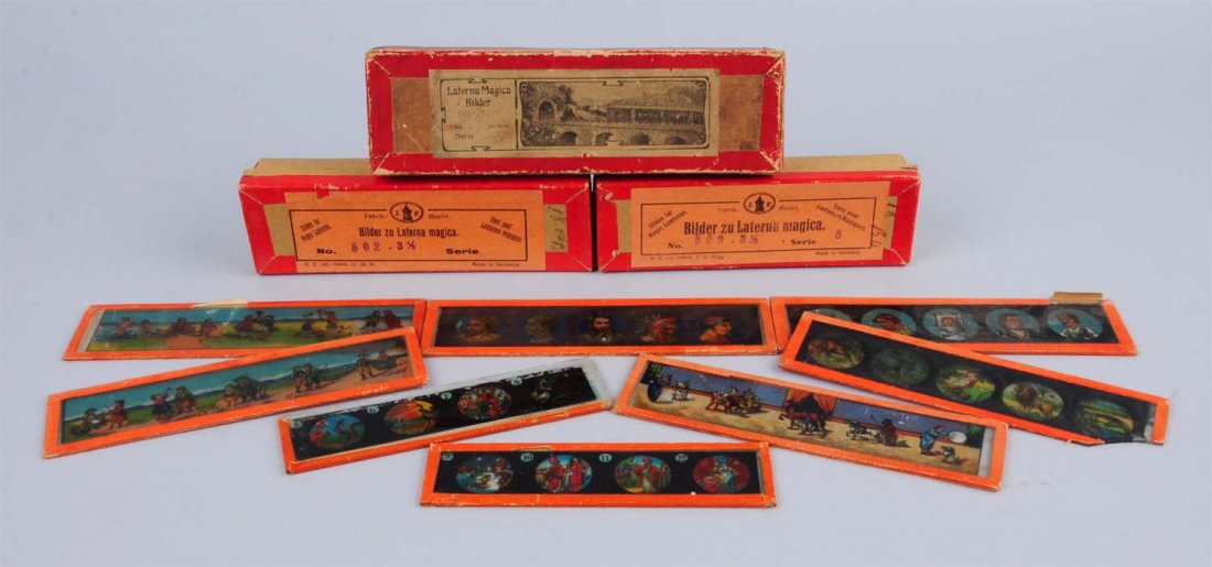 Lot Of 3: German Magic Lantern Slide Sets.: This lot includes three boxed sets of German magic lantern slides. A few cracks and chips. Condition (Very Good Plus). Size Largest : 7" L.