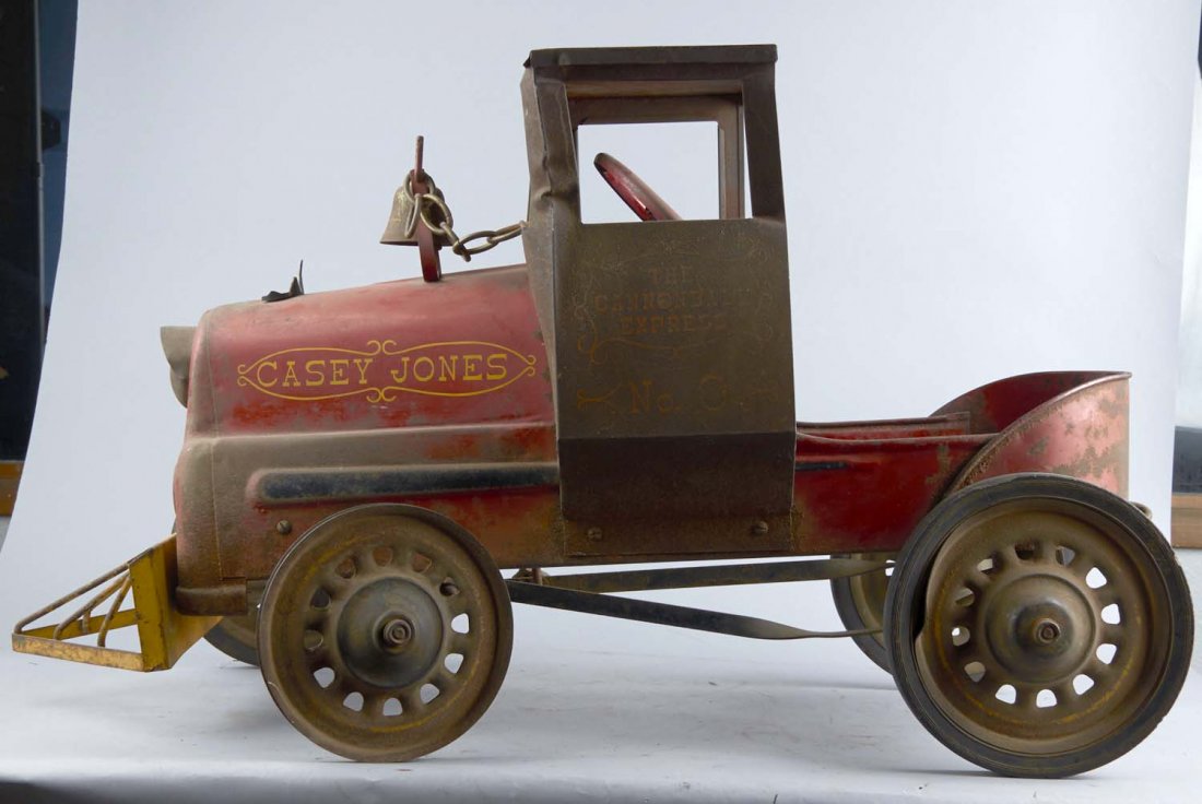 Early Casey Jones Child's Pedal Car Train: The Cannonball Express No. 9" train chain driven locomotive with bell. In original condition. Condition (Fair). Size 15" x 23" x 41