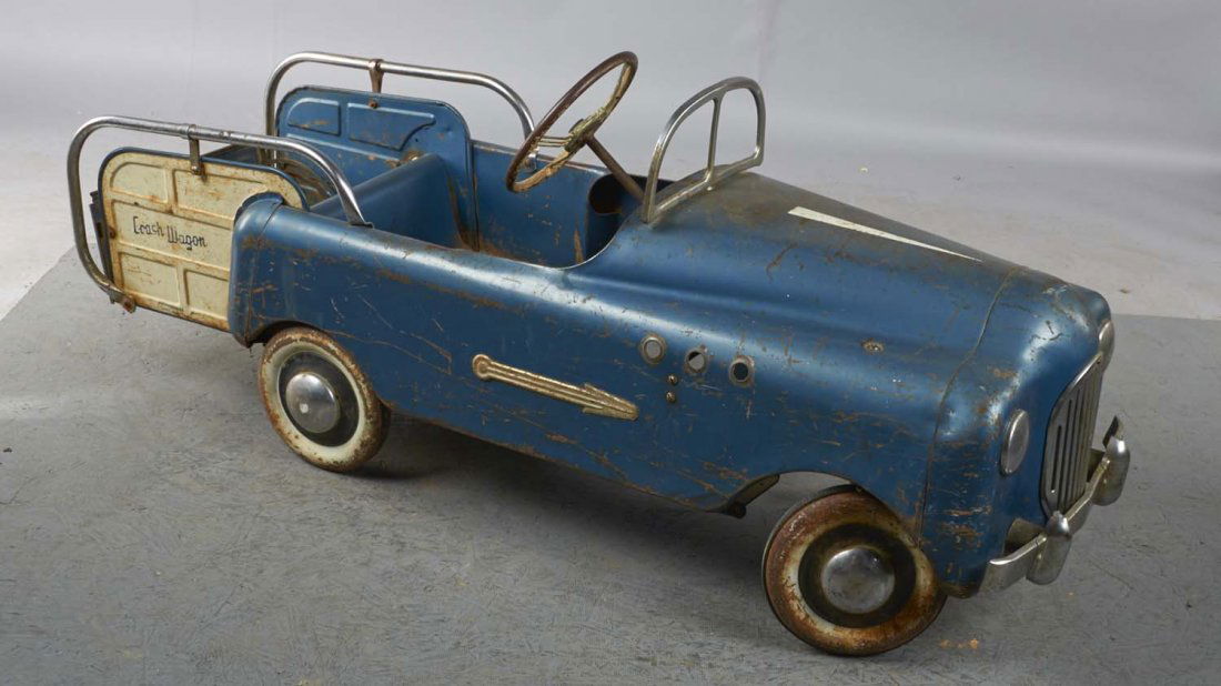 Pressed Steel Station Wagon Pedal Car: This blue pedal car with white station wagon back and ride along rails is marked "Crash Wagon" and may have included a crane attachment on back at one time. Condition (Good). Size 52" x 16" x 21"