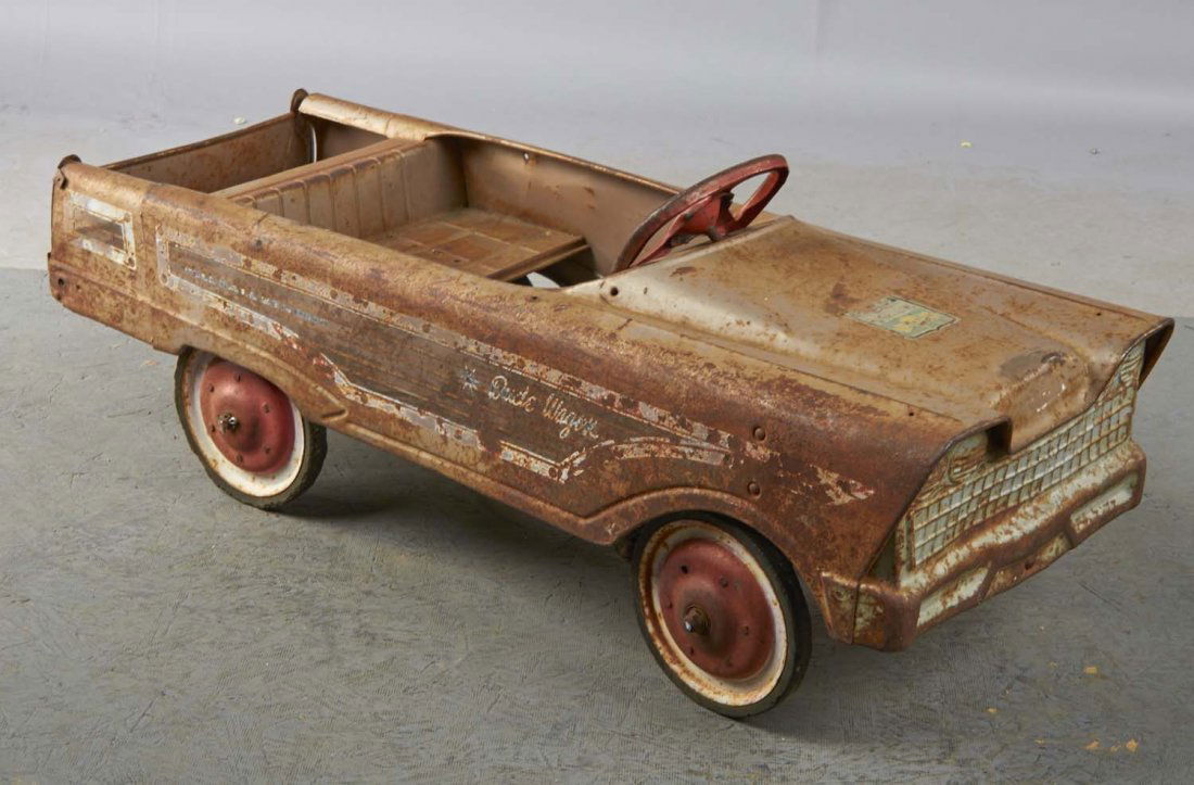 Pressed Steel Murray Dude Wagon Pedal Car: This unrestored pedal car shows original Full Ball Bearing, "Dude Wagon" paint job and has stickers for Germany and Ontario. Ready for restoration, this model includes mounting holes for rear rails, f