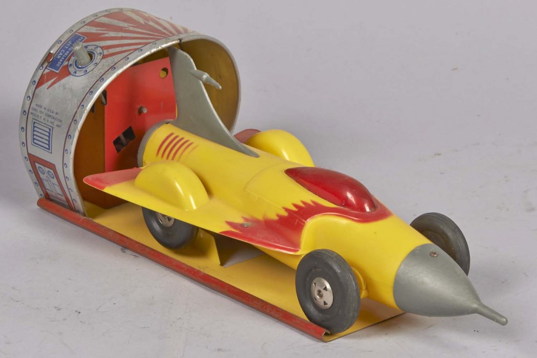 Ideal Toy Corp. Turbo-Jet Car Wind-Up Toy: Includes plastic jet car on metal litho launch station. Circa 1950s. Condition (Very good). Size 14" L.