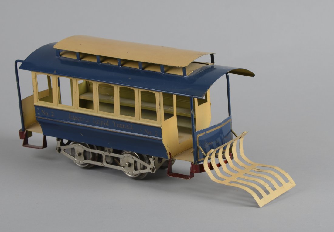 Lionel Lines No. 2 Electric Rapid Transit Trolley: Blue and tan car with red steps and fender. Condition (Good). Size 14" L.