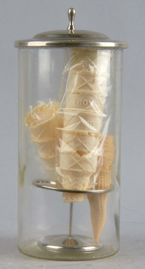 Countertop Ice Cream Cone Holder: Clear glass base with aluminum lid and internal stand to hold 4 rows of cones. Condition (Very good). Size 14" T.