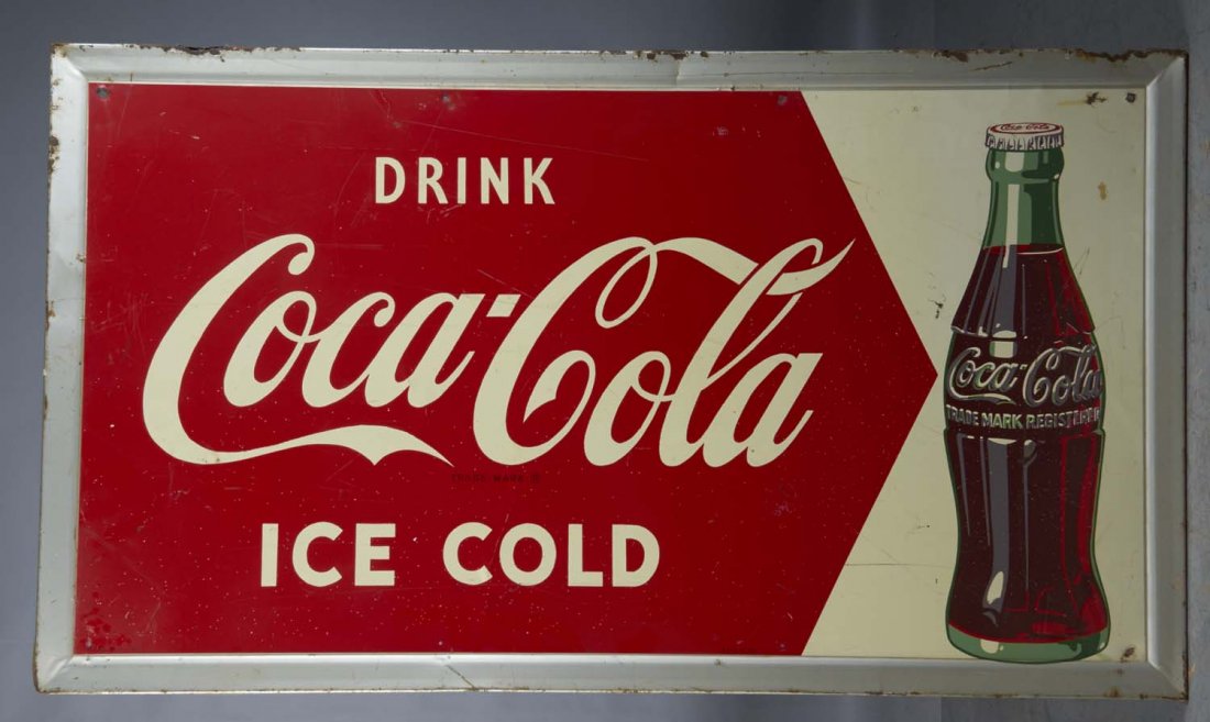 Self-Framed Coca Cola Sign: Self-framed tin lithograph Coca Cola sign with bottle. Sign reads, "Drink Coca Cola, Ice Cold." Circa 1953. Condition (Good). Size 56-1/2" x 32"