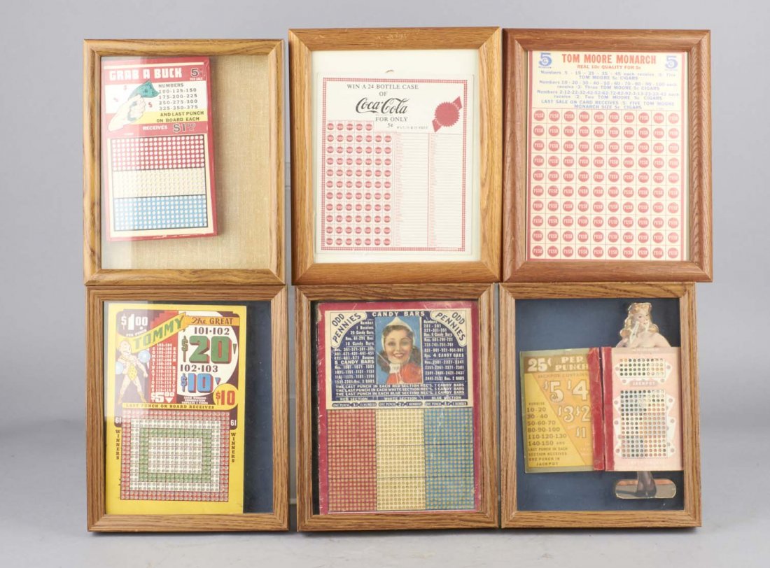 Lot Of 7: Punchboard Gambling Games In Frames: Including $1 Tommy The Great, 5¢ Coca Cola "Win a 24 bottle case of Coca Cola", 5 ¢ Tom Moore Monarch, 25 ¢ Kuter Kolors, Pinup, Odd Pennies, and 5 ¢ Grab A Buck. Condition (Good - Excellent). Siz