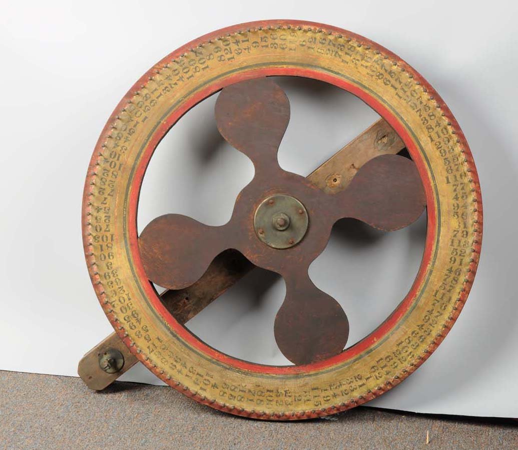 Early Large Wooden Gambling Wheel: Double sided with different number configurations on each side, including a single row of larger numbers on front and 5 rows of numbers 0-9 on the back. Condition (Good). Size 37 x 37"