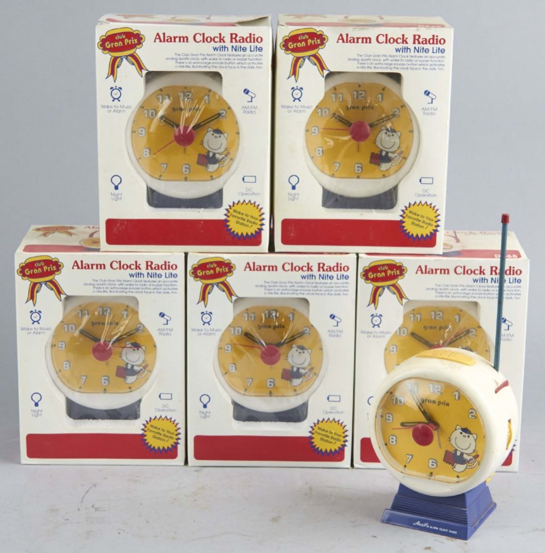 Lot Of 6: Gran Prix Night Lite Alarm Clock Radios: Including 1 - used radio and 5 - new old stock radios. AM / FM battery operated clock radios with night light and alarm. Circa 1990s. Condition (Good - Near mint). Size 5" x 6" x 8"