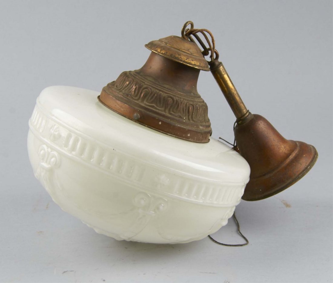 Early Milk Glass Globe Saloon Light Fixture: With ornate embossed detailing. Fixture is from a turn of the century Saloon in Northwestern New Jersey. Includes brass fixture and bulb. Condition (Very good). Size 13" D.