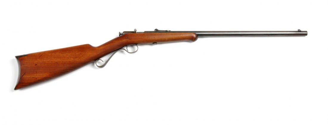 **Winchester Model 1904 Bolt Action Rifle.: Serial # NSV Fine condition Winchester Model 1904 bolt action single shot rifle chambered for the .22 short cartridge. Features a 21" round barrel that retains 90% of the original blue starting to sof