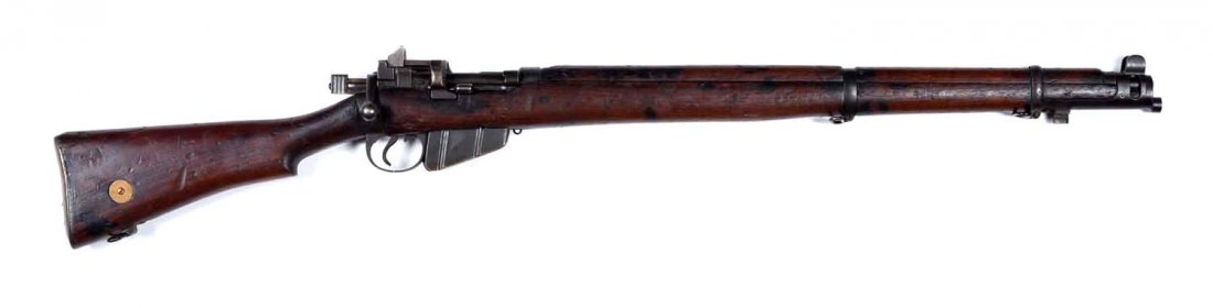 **British Enfield No. 1 Mark V Military Rifle.: Serial # 5026 Caliber .303 British. Matching bolt. Rear band stamped "Enfield 1924". Has stock disc. Perfect action. Strong bore. Wood is rough but complete. Pitting on the magazine guide. Magazine is