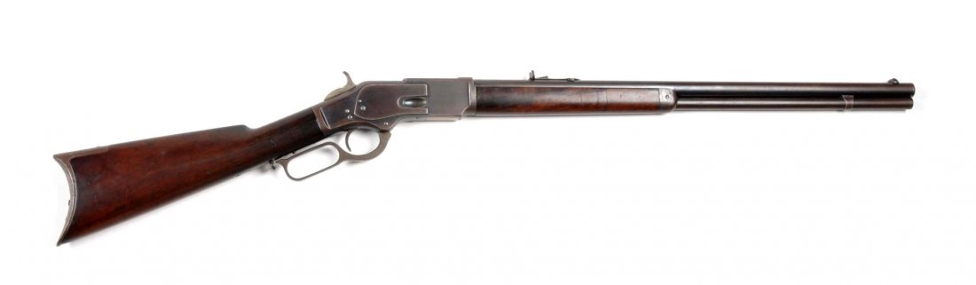 Fine Winchester Model 1873 1st Model Rifle.: Serial # 8958 According to the factory research, this gun was shipped on September 15th, 1875. Standard features include 24" round barrel, full magazine, blued finish, rifle butt, walnut stocks, and c