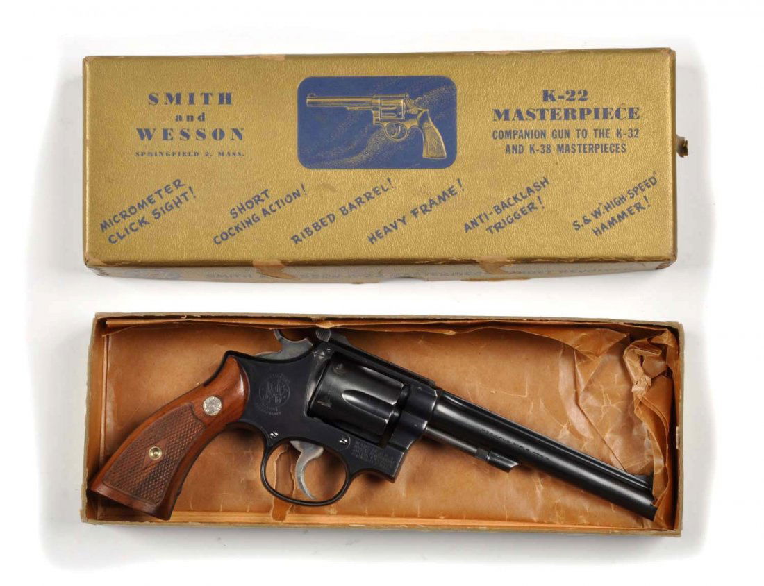 **Boxed S&W K-22 D.A. Revolver (1948).: Serial # 97867 The offered Smith & Wesson K-22 double action .22 caliber revolver was manufactured in 1948 and is standard in all respects. It is chambered for the .22 LR cartridge, has a blued finish