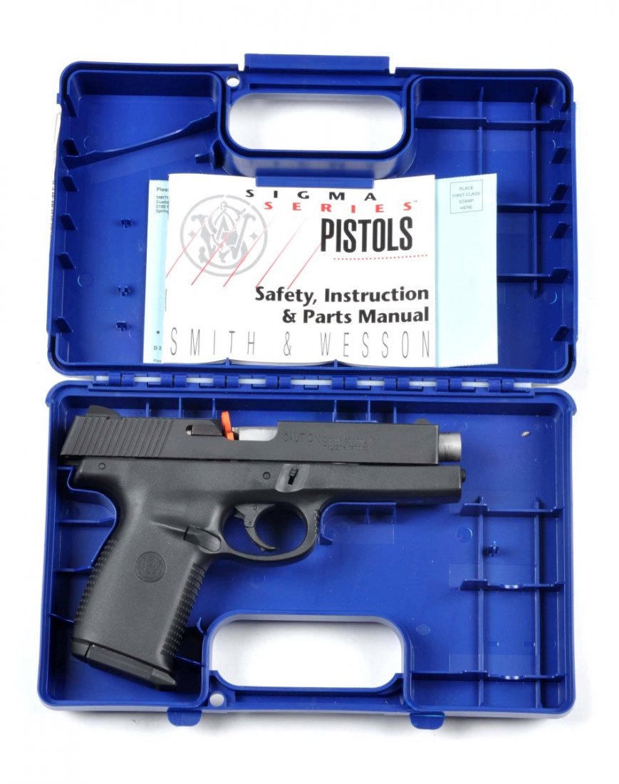 **Boxed S&W Model SW40F Semi-Auto Pistol.: Serial # PAK0800 Gun shows as new. Standard features include a 4-1/2" barrel, matte black finish, polymer frame, double action, chambered for the .40 Smith & Wesson cartridge. Mint bore and action. Co