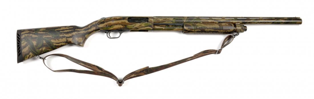 **Mossberg Model 835 12 Ga. Pump Action Shotgun.: Serial # UM62877 This gun can handle 2-3/4" to 3-1/2" shells. Not for use with slugs. Has the camo finish. Features a 24" open cylinder barrel, camo nylon stock, comes with sling, and pump action. Loo