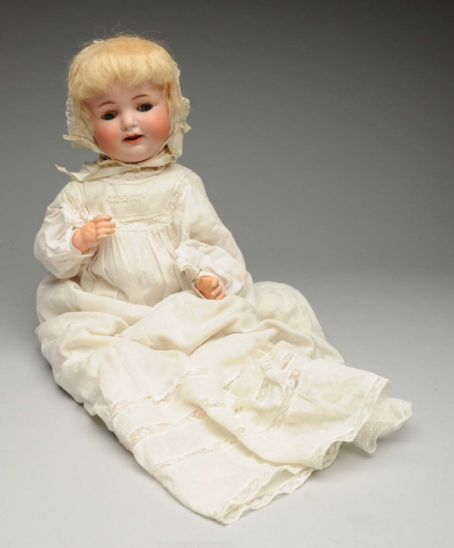 Delightful K & R Character Baby Doll.: German bisque socket head incised “K [star] R Simon & Halbig 126” with stationary eyes, real upper eyelashes, multistroked eyebrows, open mouth with two upper teeth and wiggle tongue, original moh