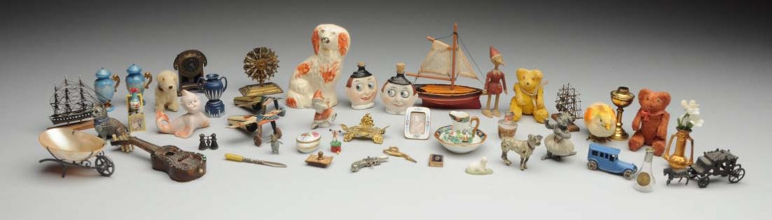 Large Lot Of Antique Miniatures.: Staffordshire dog, two teddy bears, two tin airplanes, German dog, two covered urns with broken parts, English china pitcher and bowl set, china picture frame, two googly face perfume bottles, tin clo