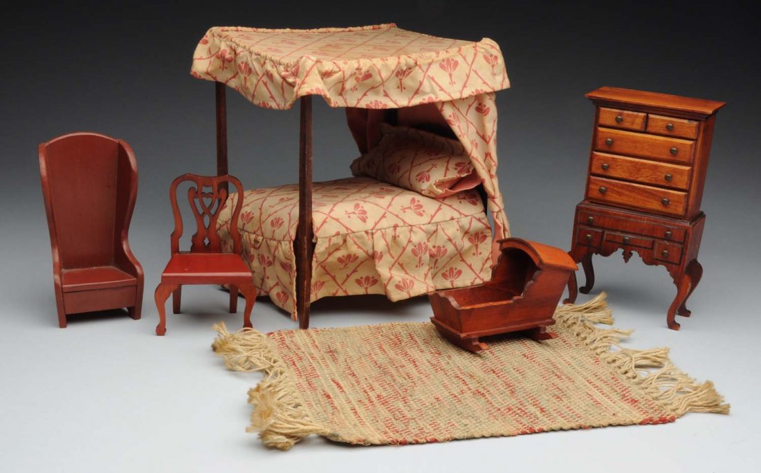 TynieToy 5 Piece Bedroom Set.: 1920's - 40's. Set is marked and includes four poster canopy bed and New England Cradle. Condition (Excellent). Size Tallest: 7 - 1/2".