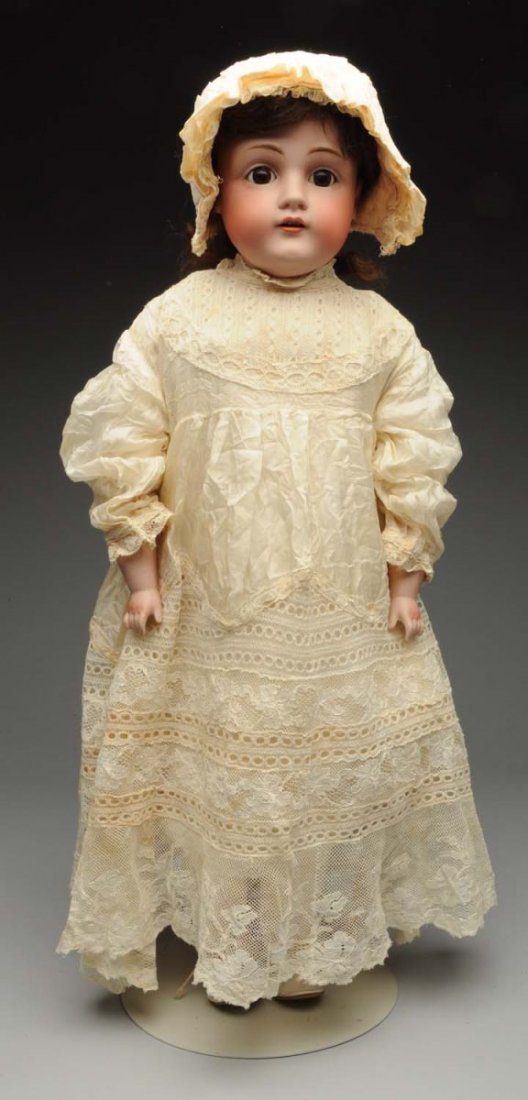 Lovely Kestner Child Doll.: German bisque shoulder head incised “154 12 dep” with multistroked eyebrows, sleeping eyes, painted lashes, open mouth with upper teeth, original mohair wig; original clean kid body with Kestner p