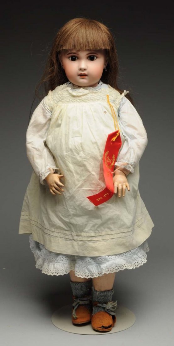 Sweet SFBJ Bébé Doll.: French bisque socket head from Jumeau mold, incised “SFBJ Paris 12” (a few wig pulls), multistroked eyebrows, dark paperweight eyes, painted upper and lower lashes, open mouth with six upper teeth
