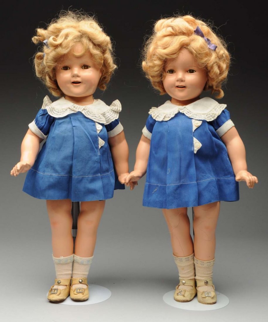 Lot Of 2: Ideal Shirley Temple Dolls.: All composition. Both are all original with wigs, clothing, underwear, shoes and socks. Both are fully marked on the heads and one is marked on the body. One has a Shirley Temple tag on her dress. One