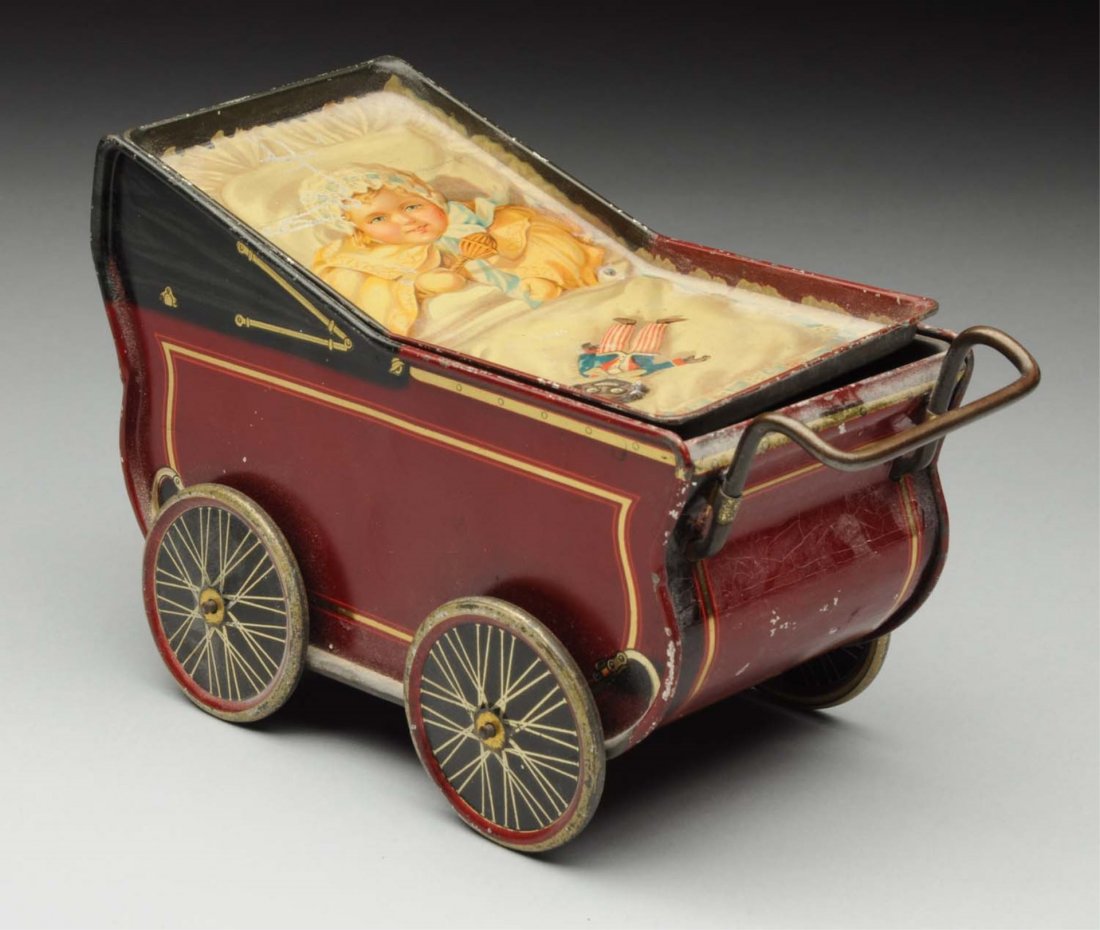 Rare Biscuit Tin Carriage.: Marked on bottom “The United Co-operative Baking Society, Glasgow, Clyde bank & Belfast”; lid shows lithographed baby with a Golliwog. Some wear. Darling item! Condition (Very Good). Size 7" L.