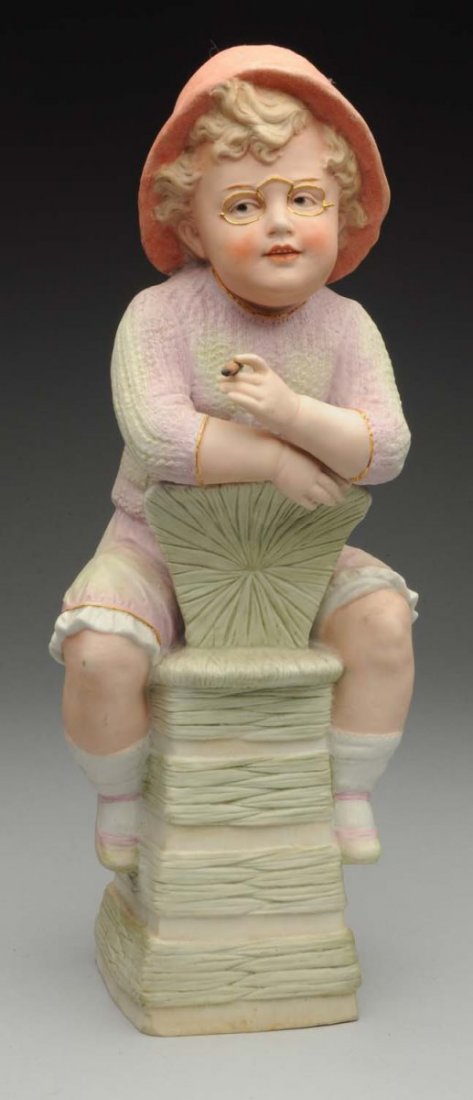Gebr. Heubach Boy Figurine.: German bisque marked with Heubach sunburst stamp, exquisite modeling on this fellow as he sits holding a cigar! Condition (Excellent). Size 14" T.