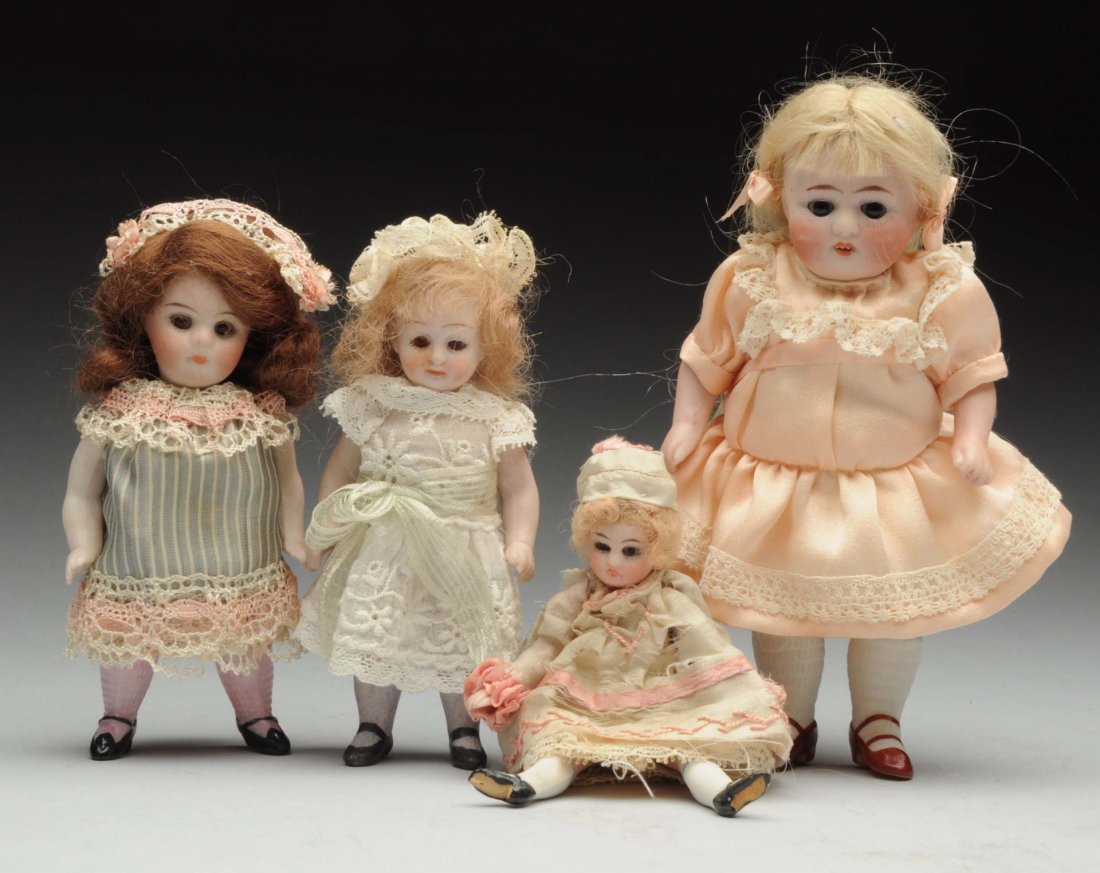 Lot Of 4: German All-Bisque Dolls.: Largest incised “35 1005” with sleeping eyes, original mohair wig, open mouth (cheek rub), stiff neck, jointed shoulders and hips; 540 girl with stiff neck and brown glass eyes; 40 Kestner girl wi