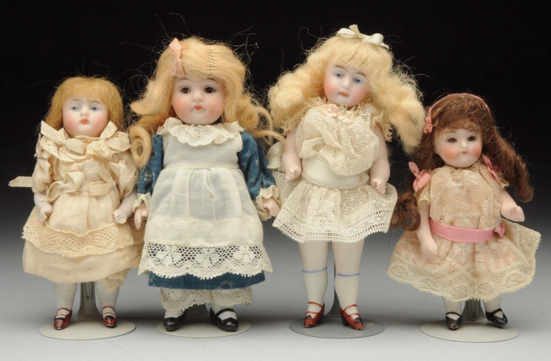 Lot Of 4: All-Bisque Dolls.: All are German, three with stiff necks and jointed shoulders and hips. Two are Kestners with painted eyes, one with swivel neck (one with chip on hip). Two are 150 pouty chubby Kestners with glass eye
