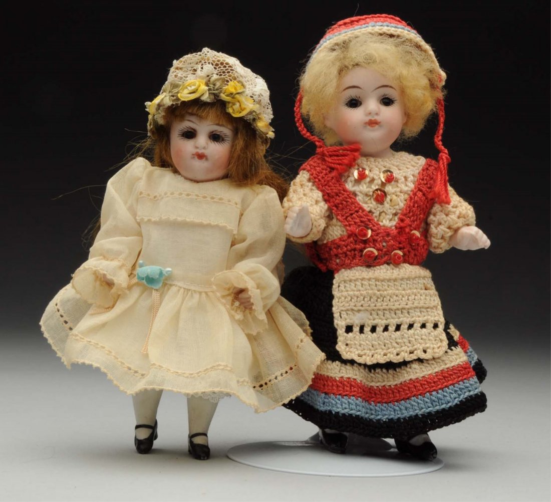 Lot Of 2: All-Bisque Dolls.: Both German by J.D. Kestner. Girl in crocheted outfit marked 150 with glass eyes (cannot check complete doll as outfit is sewn on). Unmarked pouty girl with sleeping eyes, closed mouth, redressed. Bot