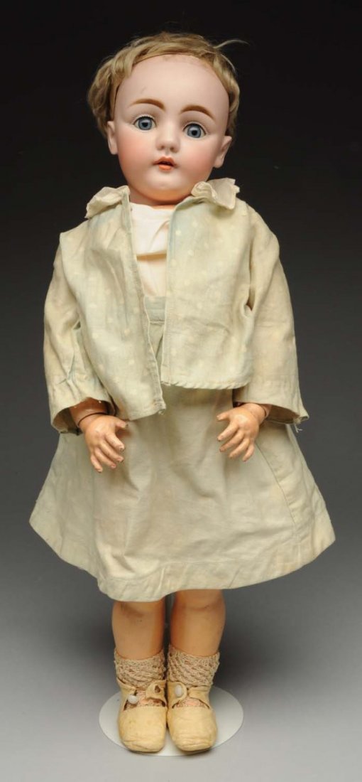 Remarkable Kestner Child Doll.: German bisque socket head 143 (small chip on neck socket) with dark multistroked eyebrows, sleeping eyes, painted upper and lower lashes, open mouth with two upper teeth, plaster pate, short bobbed bl