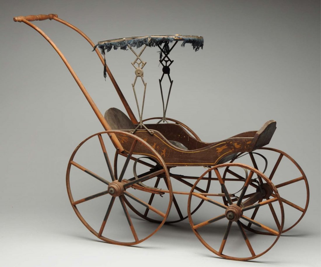 Joel Ellis-type Doll Carriage.: Beautiful stenciling on side of body, leather roof with metal sidepieces, wood wheels. All parts look original. Condition (Very Good). Size 28" x 26".