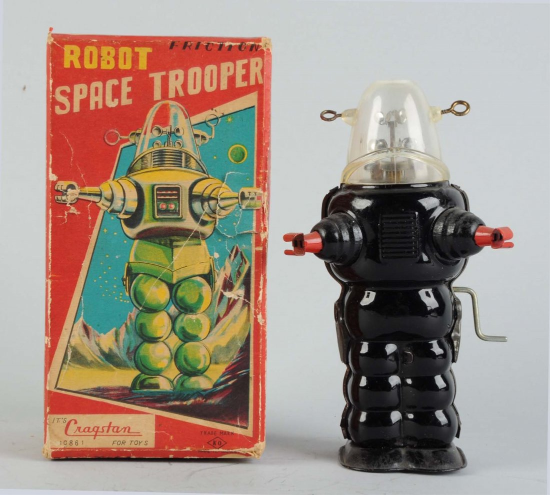 Japanese Tin Litho Trooper Robot.: In original box. Crank friction. Made in Japan by Yoshiya. Original box has nice colored graphics marked "Cragstan" in bottom left corner, does have some tearing and creasing on right side of box. Rob