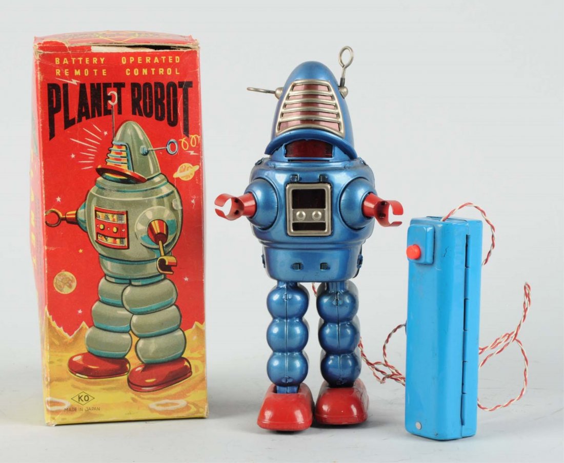 Japanese Tin Litho Planet Robby Robot.: Battery - Operated. In original box. Made in Japan by Yoshiya. Box has nice colored graphics of robot in front, does have some creasing and wear, split on seam between top and side flap. Remote contro