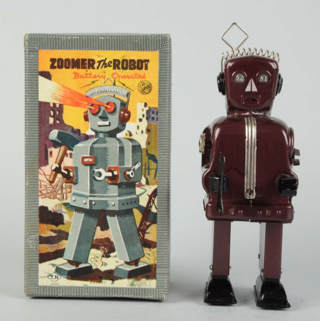 Japanese Battery-Operated Tin Litho Zoomer Robot.: In original box. Box has some minor edge wear, robot has very little wear. Scarcer color variation. Made in Japan by Nomura. Marked "GW" on box for original designer, George Wagner. Has cardboard neck